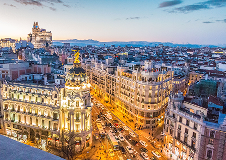 Regeneron location in Madrid, Spain. Skyline of Madrid with a view of a busy street.